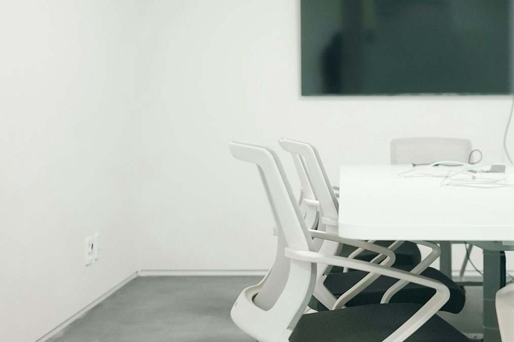 Office Movers Office movers moving a piece of furniture together.